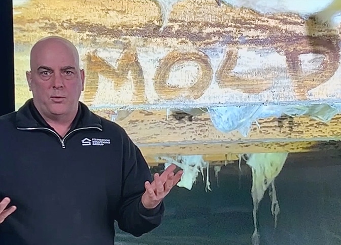 Mold removal before and after soda blasting demonstration by Foundation Solutions Group.