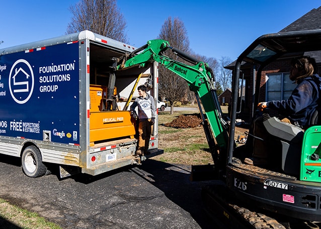 loading with digger into truck